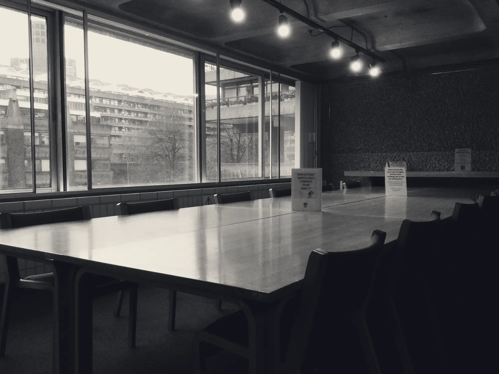 Empty boardroom with tall windows
