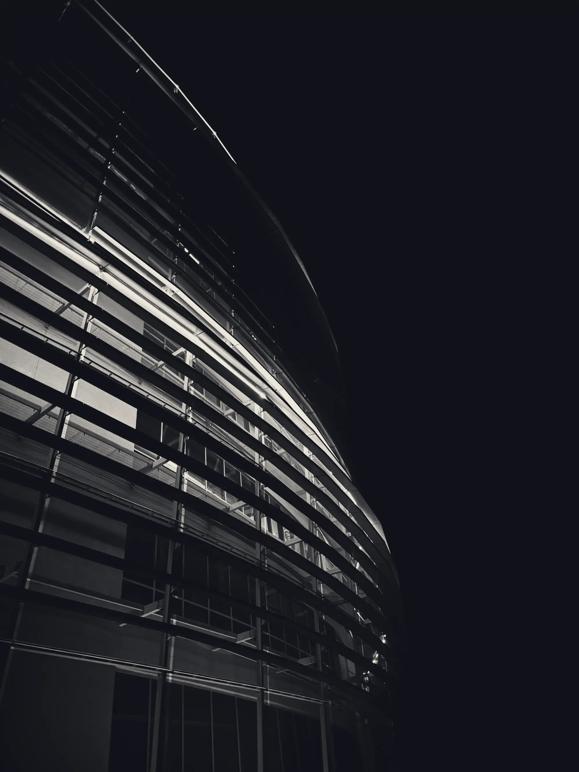 Curving glass facade in monochrome