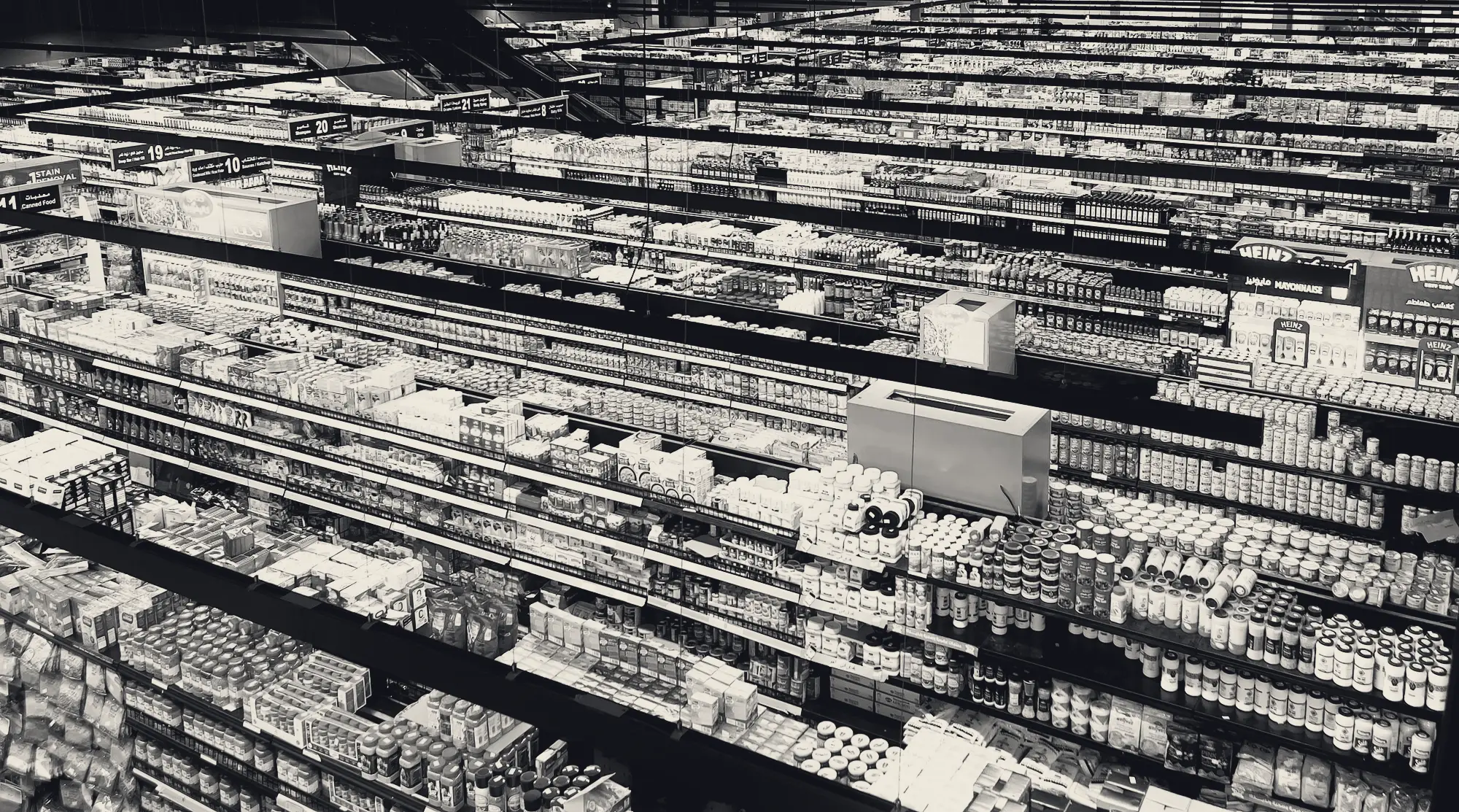 Supermarket aisle stocked with consumer goods