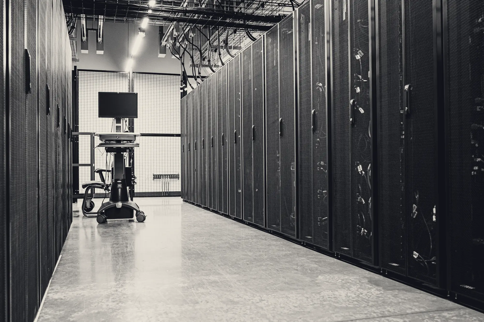 Data centre corridor lined with server racks