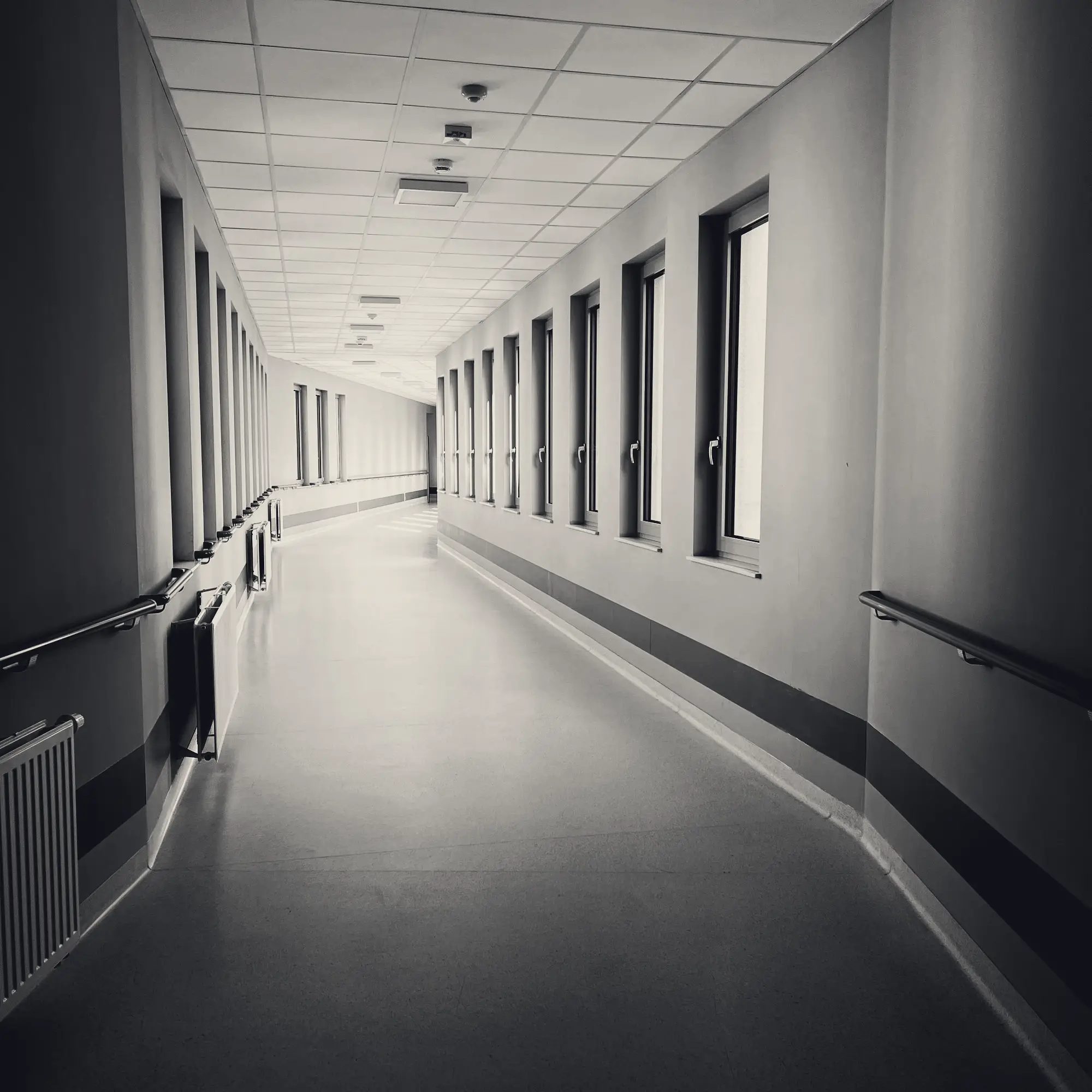 Bright, empty hospital corridor